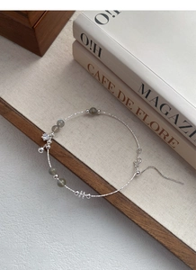 Close-up of S925 sterling silver beaded bracelet with moonstone and star charm