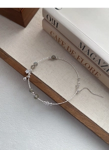 Detail of S925 sterling silver beaded bracelet with labradorite stones and star charm