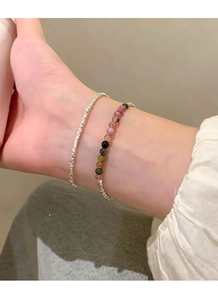 Close-up of S925 sterling silver beaded bracelet with colorful tourmaline stones on wrist