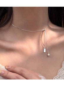 Close-up of S925 silver necklace with elegant pearl pendant and adjustable slide chain