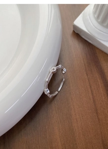 Close-up of S925 sterling silver open ring featuring vintage heart relief and beaded edge