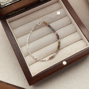 S925 sterling silver bracelet with multi-color tourmaline beads in a wooden jewelry box