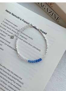 Detail of S925 sterling silver beaded bracelet with irregular blue crystal beads