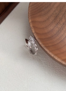 Macro shot of silver S925 snake ring with marquise zircon and unique textured finish