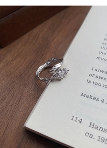 Macro detail of S925 silver snake ring featuring marquise zircon and irregular texture