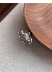 Macro shot of S925 silver snake ring featuring marquise zircon and rocky texture finish