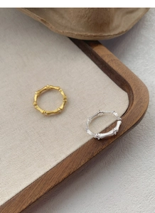 Detailed close-up of S925 silver bamboo rings with brushed texture and zircon accents