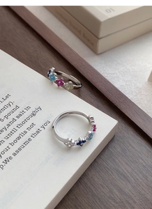 Detailed macro view of S925 sterling silver ring with colorful zircon flower patterns