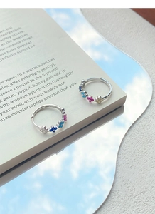 Macro shot of S925 sterling silver stamp on adjustable rainbow zircon flower ring