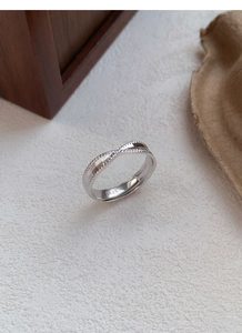 Close-up of S925 sterling silver twisted ring with hallmark and textured finish