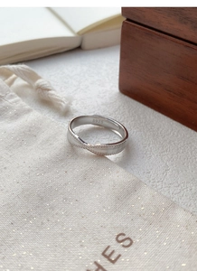 Macro shot of S925 sterling silver twisted ring with fine textured surface detail