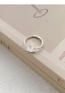 Macro shot of S925 sterling silver rocking horse ring with adjustable open band detail