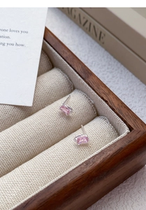 Macro shot of rectangular pink zircon earrings with S999 silver four-prong setting