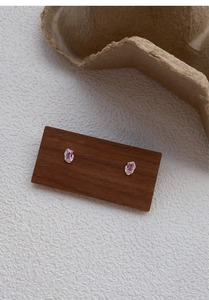 Macro detail of pink rectangular zircon studs with textured S999 sterling silver setting