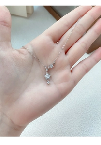 Close-up of S999 sterling silver star pendant necklace with sparkling zircon stones