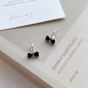 S925 sterling silver bow earrings featuring black zircon heart stones in a sleek hoop style