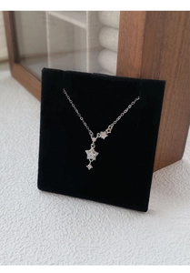 Detailed close-up of a shimmering S999 silver star pendant with sparkling pavé crystals