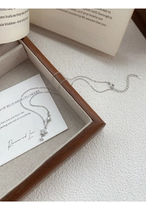 Detailed macro view of S925 sterling silver star pendant necklace with cubic zirconia