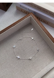 Detailed view of S925 sterling silver ocean bracelet with starfish and shell charms