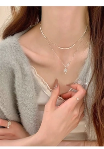 Detail of S999 sterling silver double-layer necklace with star pendant and matching rings