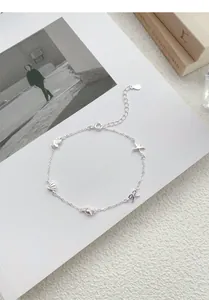 Detailed view of S925 silver ocean-themed bracelet with starfish and shell charms