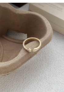 Detailed macro view of the cute golden cat paw prints on an adjustable S999 silver ring