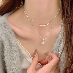 Elegant S999 sterling silver double-layer necklace with sparkling star pendant for women