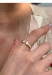 Close-up of S999 sterling silver cat paw ring featuring retro embossed patterns on open band