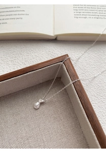 Détail du collier S999 en argent sterling avec pendentif sac de chance brossé
