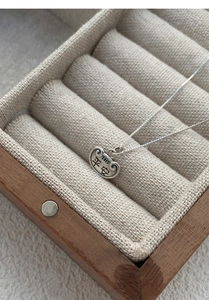 Detailed close-up of S925 sterling silver Ruyi lock pendant with Pingan engraving