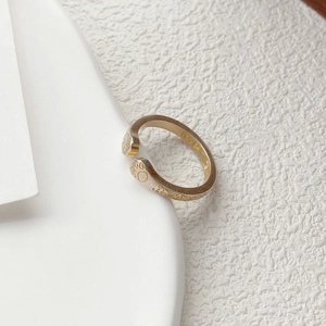 Minimalist S925 sterling silver open ring featuring a cute hollow cat paw design on white board