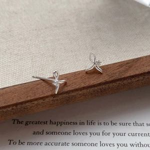 Minimalist S999 silver fishtail stud earrings with ribbon bow and sparkling cubic zirconia