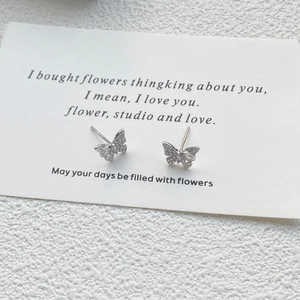 Elegant S999 sterling silver butterfly stud earrings with sparkling cubic zirconia stones