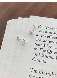 Close-up of dual-layer sterling silver butterfly stud earrings with secure screw ball backs