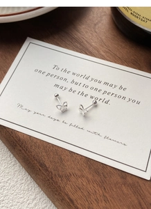 Detail of 999 sterling silver double butterfly stud earrings with secure screw back design