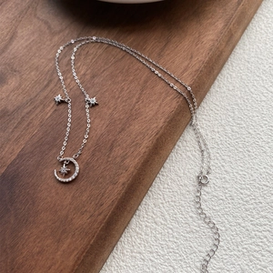 Elegant S999 sterling silver moon and star necklace with shimmering cubic zirconia
