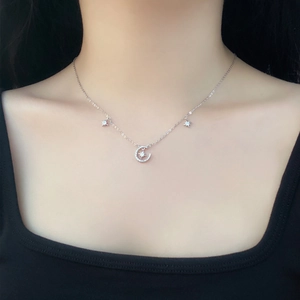 Elegant S999 sterling silver moon and star necklace on a model for a luxury look