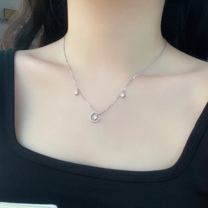 Elegant S999 sterling silver moon and star necklace with shimmering diamonds for women
