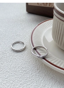 Detail of S999 silver rings featuring handcrafted hammered texture and adjustable bands