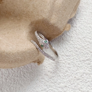 S925 sterling silver snake ring with sparkling white cubic zirconia and green eyes