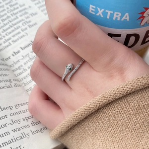 Elegant S925 sterling silver snake ring with pavé diamonds and green gemstone eyes