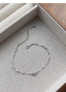 Detail of S925 sterling silver bracelet with sparkling zircon and hallmark on jewelry box
