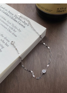 Detailed close-up of S925 sterling silver bracelet with sparkling round zircon and lobster clasp