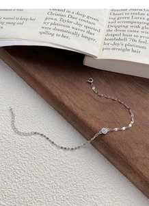 Detailed macro view of S925 silver chain with sparkling round zircon and extender chain
