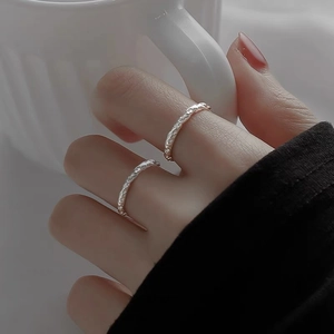 999 sterling silver couple rings with textured candy paper finish and open design