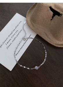 Detail of S925 sterling silver bracelet showing the round zircon and lobster clasp closure