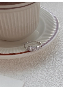 Detailed close-up of S925 sterling silver snake-shaped ring with pavé-set sparkling zircons