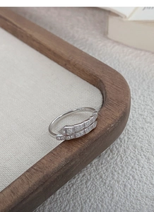 Macro shot of S925 sterling silver snake ring with pavé diamond texture detail