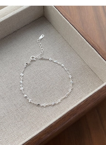 Detailed view of S925 sterling silver rose bracelet with lobster clasp and extension chain