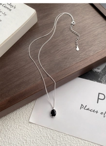 Detailed view of 925 sterling silver chain with black zircon pendant and S925 hallmark